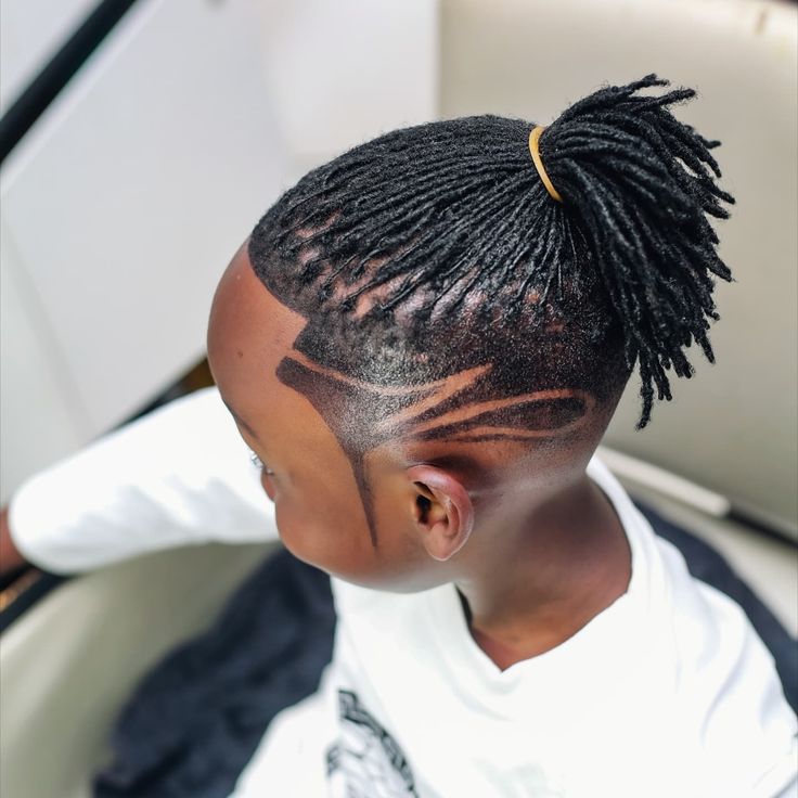 Kid's fresh haircut and smile at Culture Kutz Nyali
